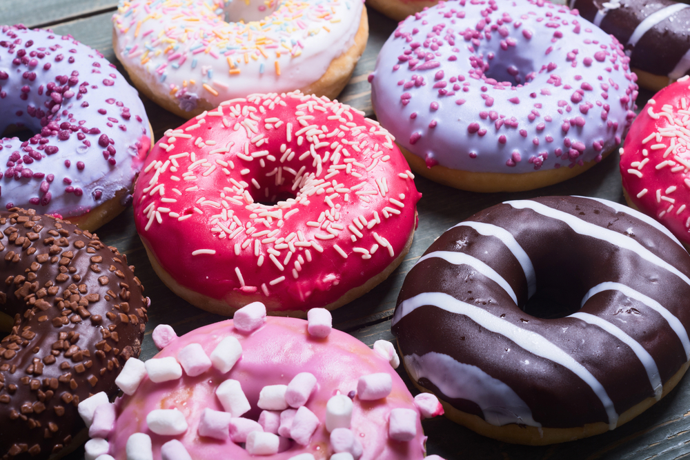 Close up of colorful donuts.